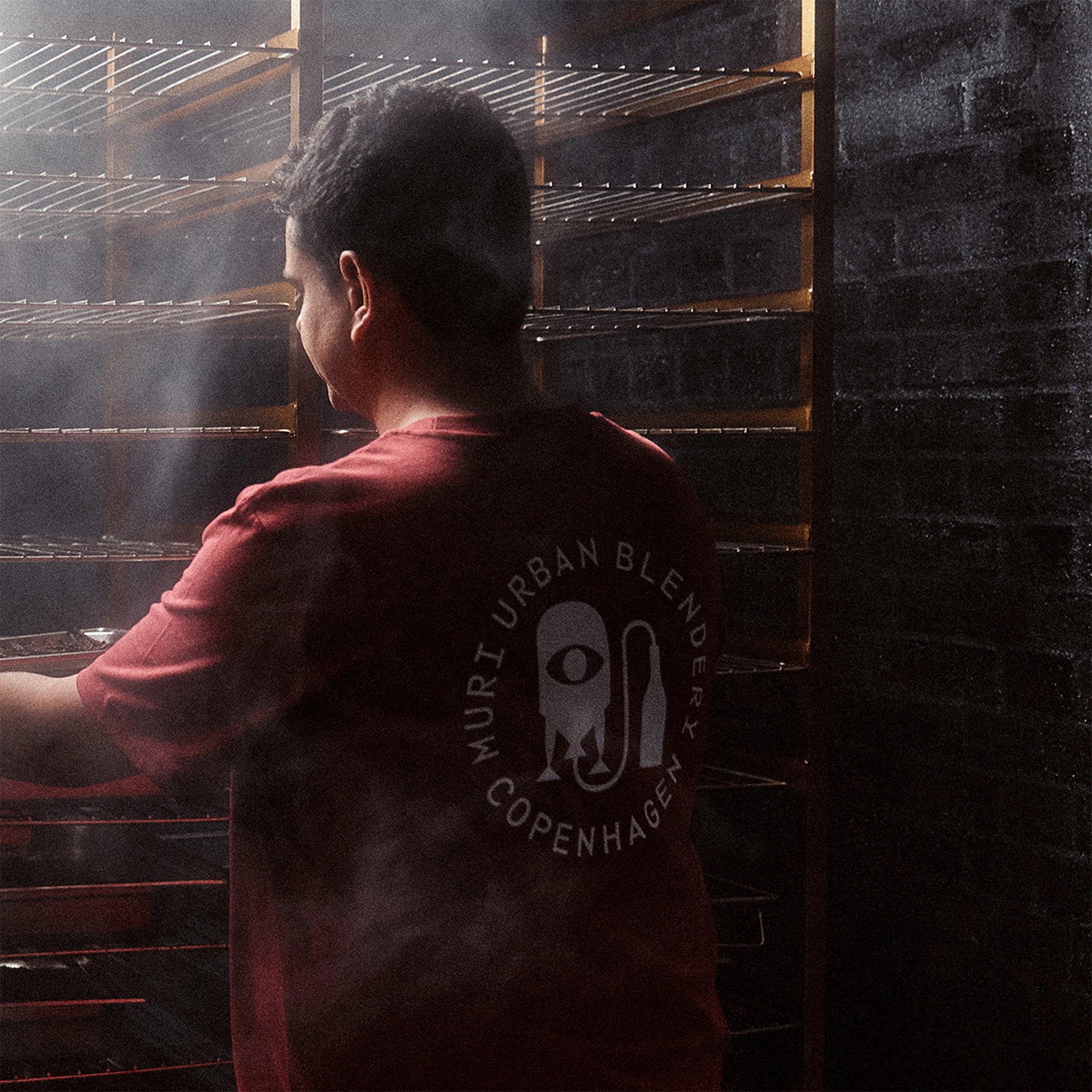 Person getting ingredients out of smokery door