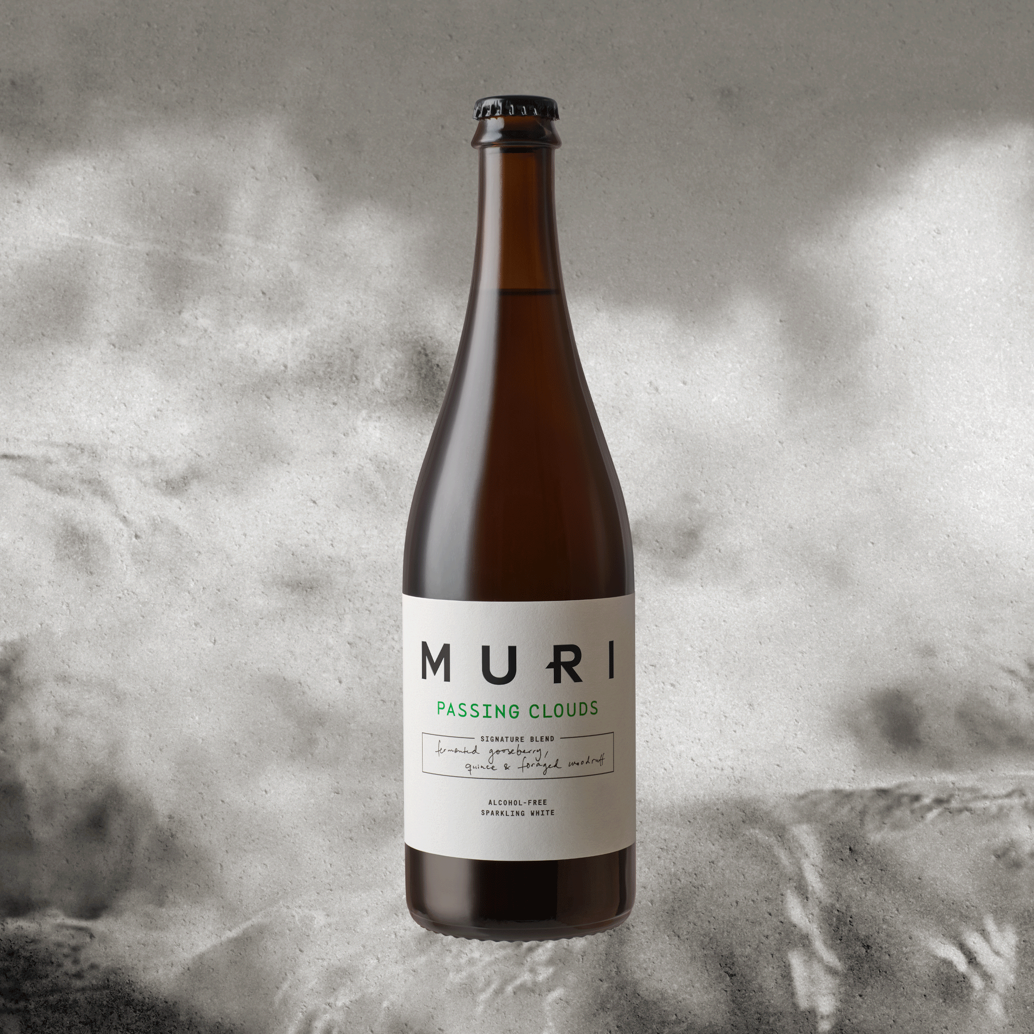 Bottle of Passing Clouds on concrete background