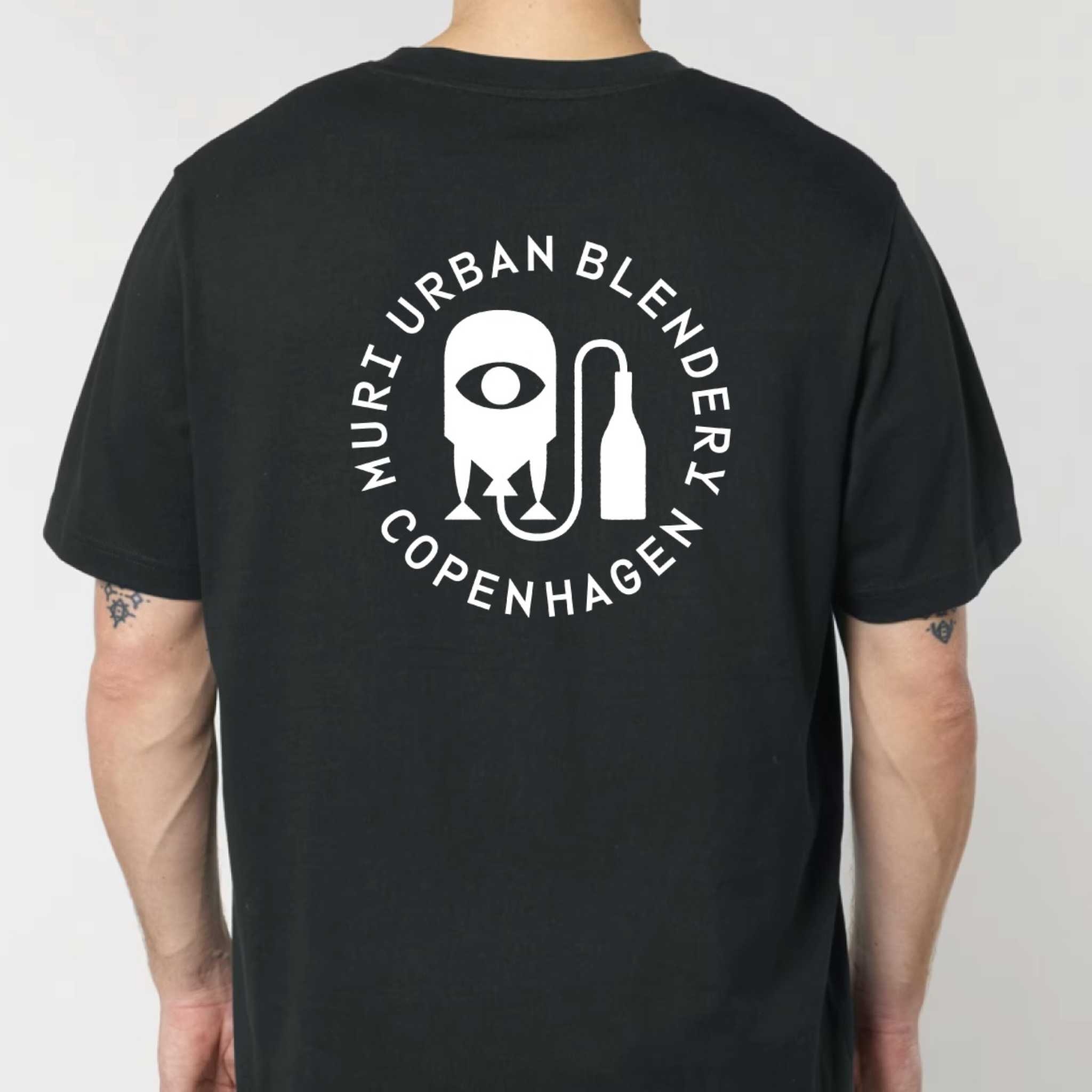 Black t-shirt with white logo and text on the back, worn by a person against a plain background